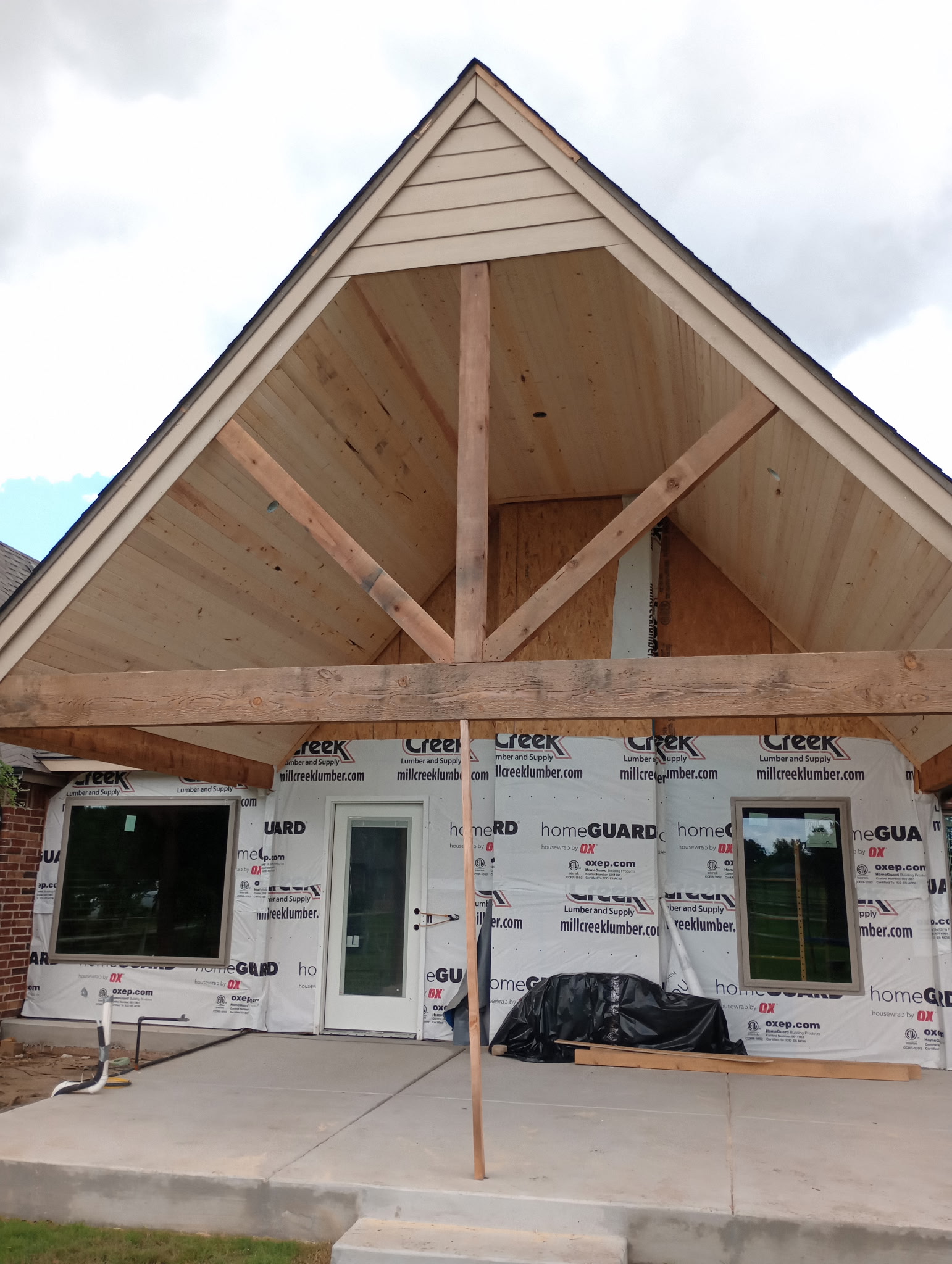 Timber porch gable and entry framed on the front of a house